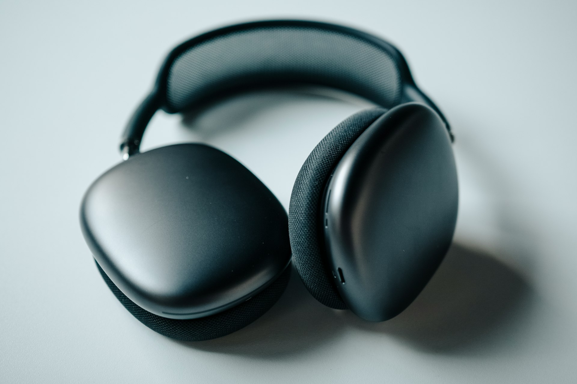 black headphones on white table